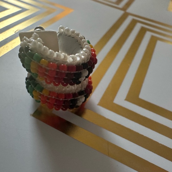 pair of white leather-wrapped rainbow beaded hoop earrings. - Picture 3 of 8